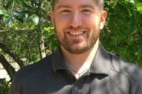 james wearing a warriors heart polo shirt
