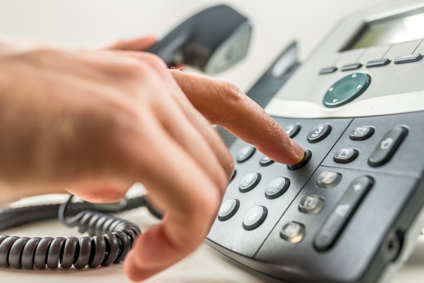 hand dialing a phone to contact warriors heart