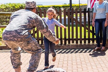 daughter running to greet her father as he returns from combat