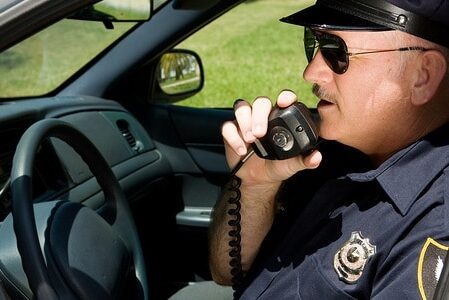 police officer radioning in
