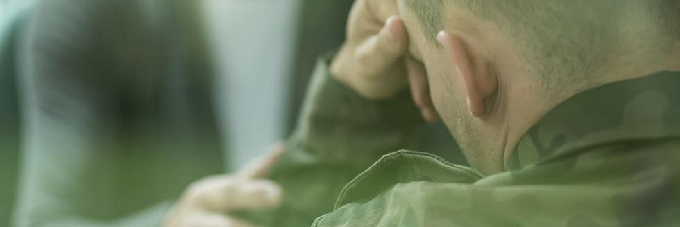 soldier suffering from PTSD with therapist