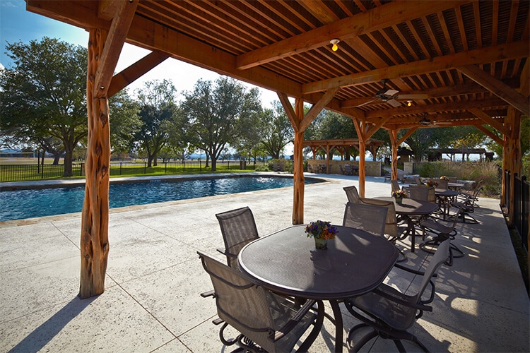 Poolside Tables - Warriors Heart is an addiction and PTSD treatment center for active military, veterans, and first responders. Contact us today at (844) 448-2567.