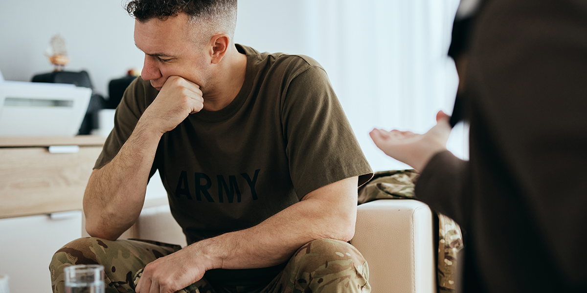 warrior in therapy sitting look right hand on chin