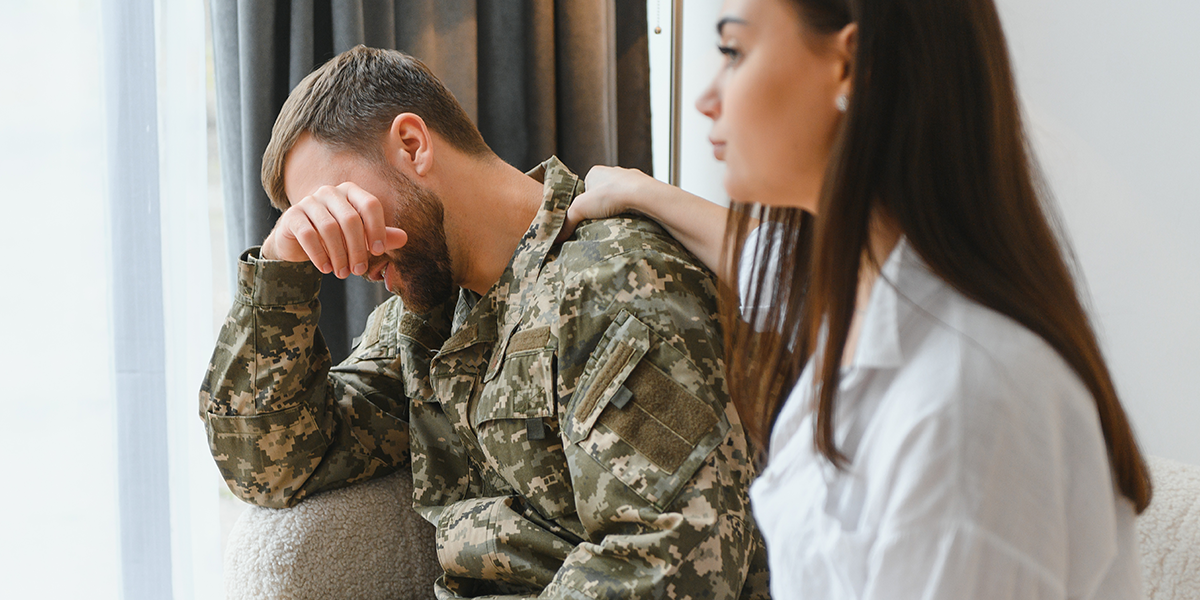 stressed warrior hands on head sitting on couch in therapy