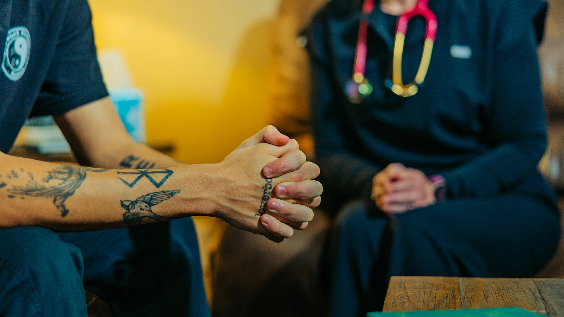 warrior in room clasping hands