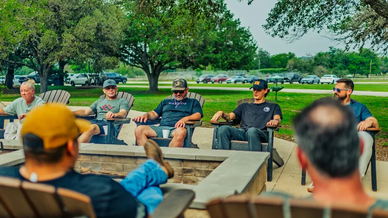 thumbnail feature alumni program warriors by fire pit 01